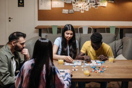 Are board games better than video games, a group of people playing a board game (1)
