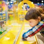What Stores Sell Board Games Where to Find and Buy Them, a child looking at lego constructible in a store